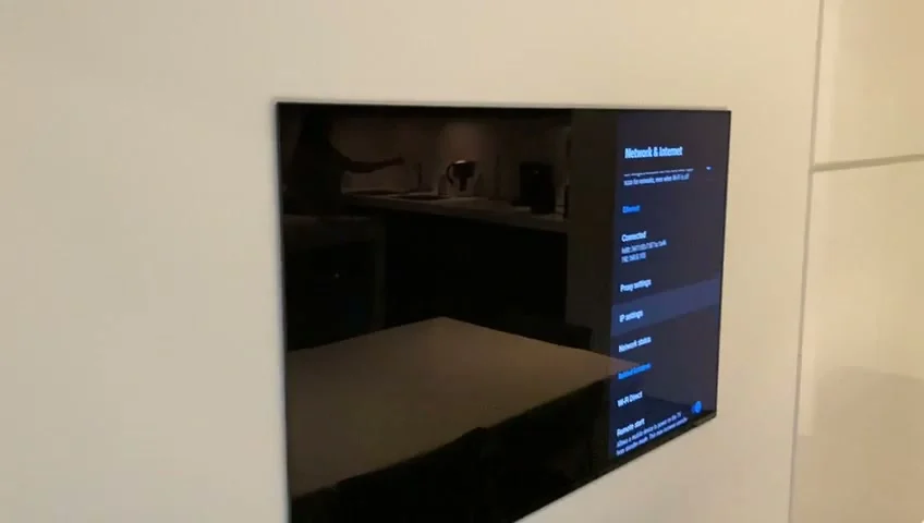 Flush-mounted Sony OLED television installed in a Highgate kitchen