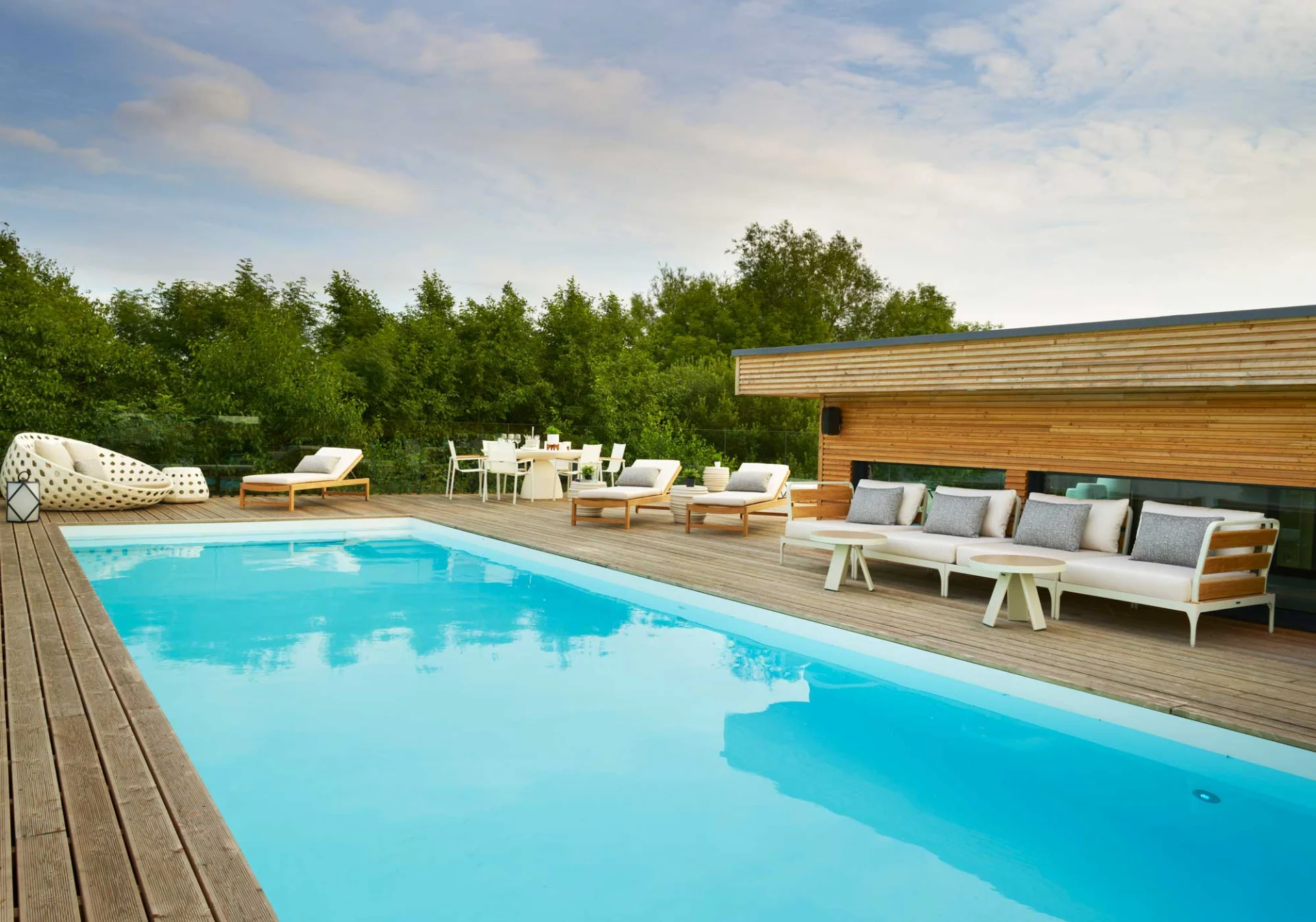 Cotswolds outdoor swimming pool with timber deck