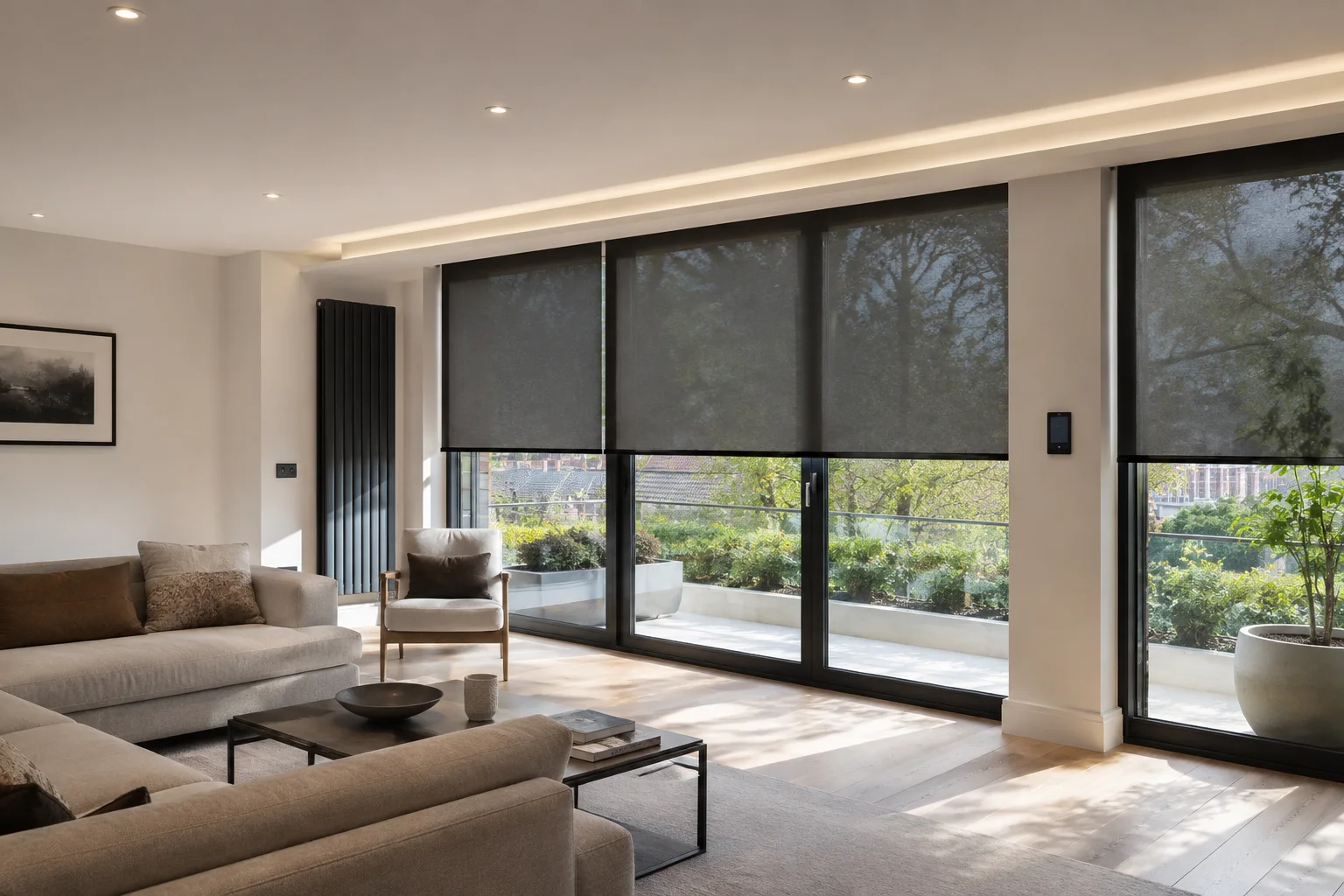 Contemporary London living room with motorised roller blinds reducing sunlight through large windows.