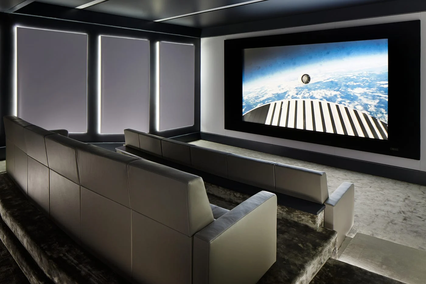 Flexible media room with a large screen and relaxed family seating
