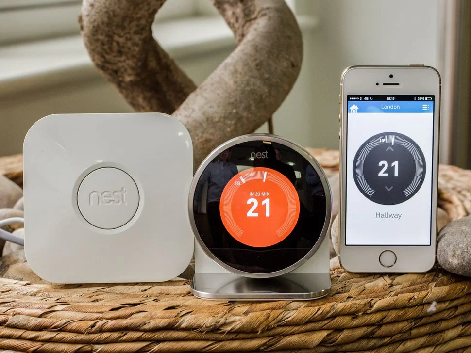 Nest thermostat with its heat link and phone app