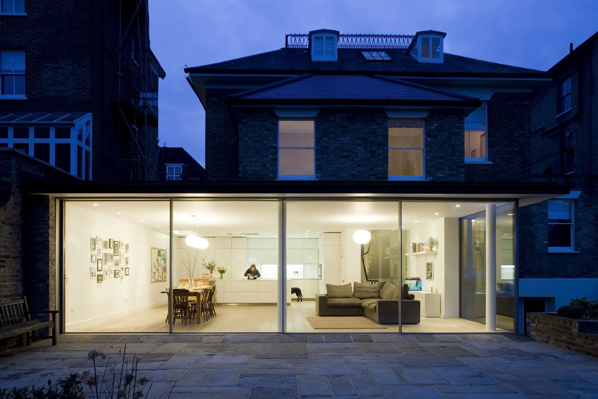Highbury Hill modern rear extension illuminated at dusk