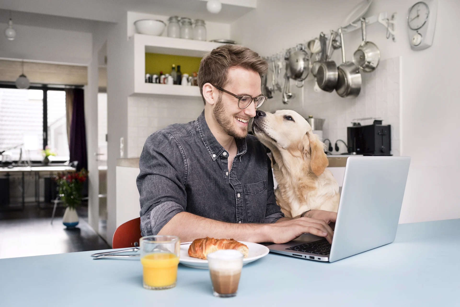 Working from Home, man enjoying his wifi with his laptop and dog