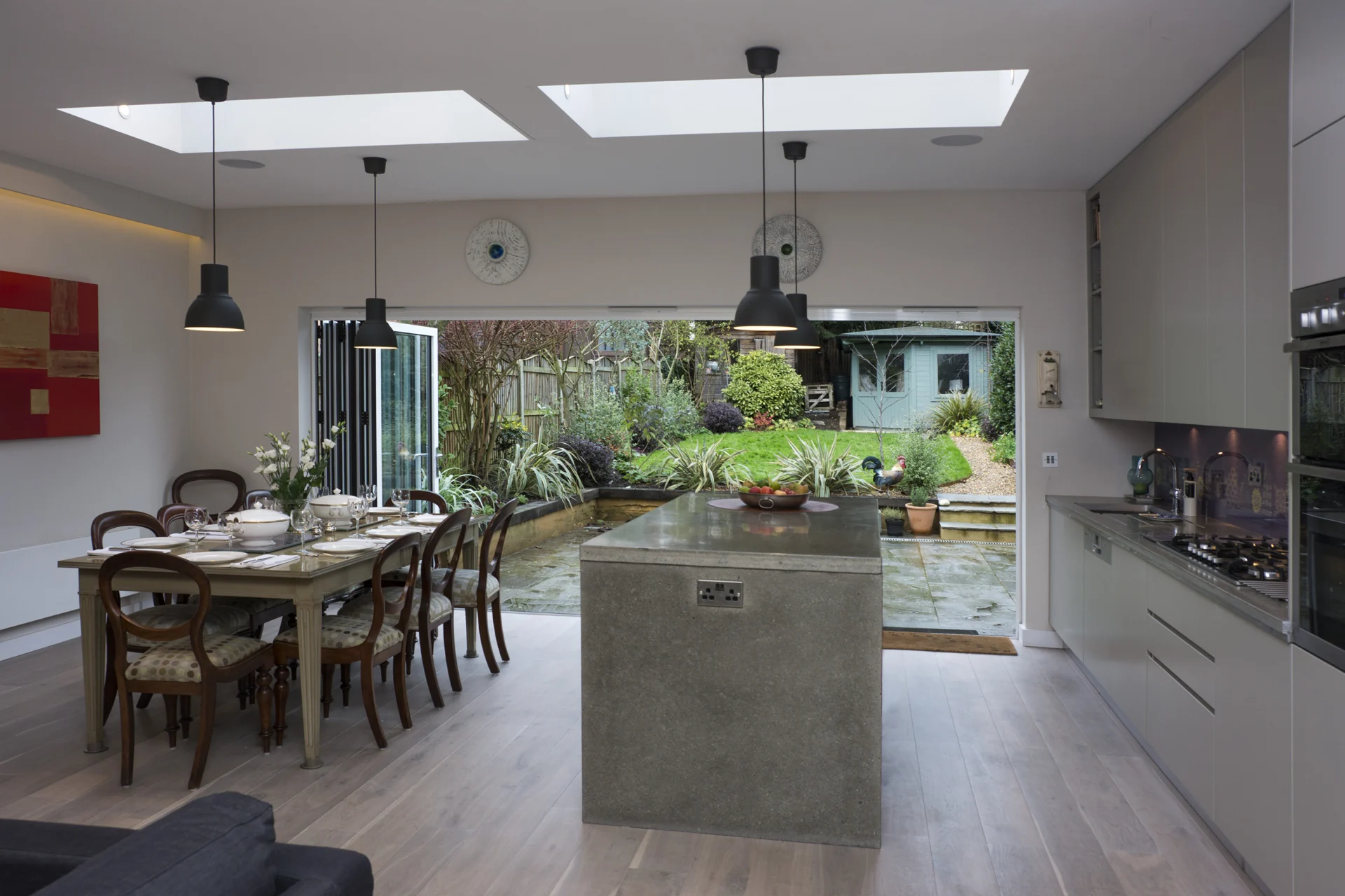 Swains Lane kitchen and dining room with Lutron lighting