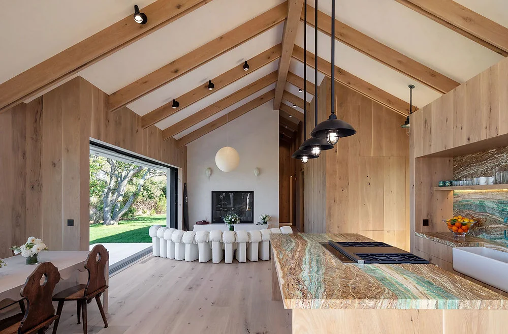 Timber-ceiling dining room with pendant lighting