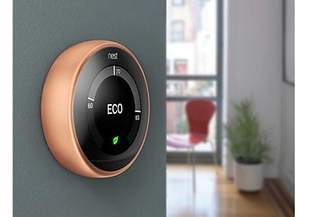 Copper Nest thermostat mounted on a wall
